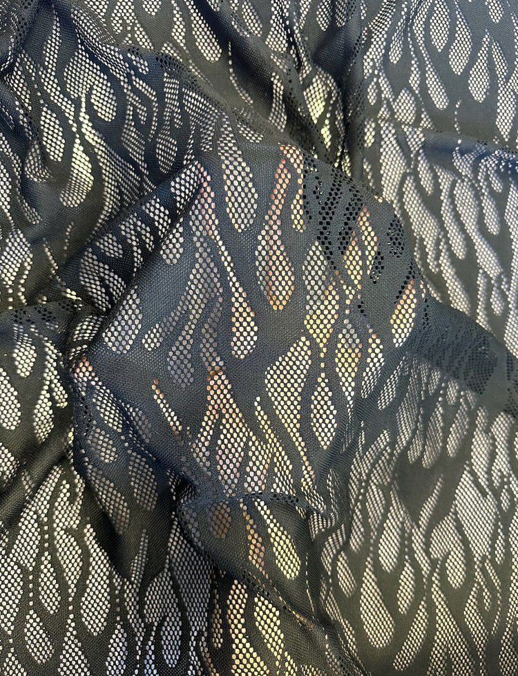 black flame mesh fabric with hand underneath