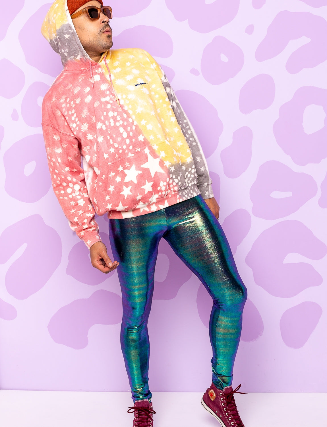 man wearing metallic lycra leggings
