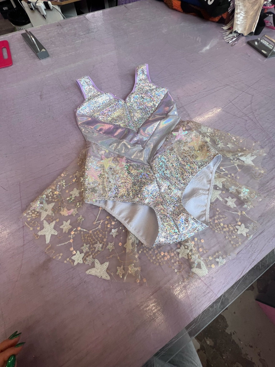 silver metallic leotard with mesh sequinned skirt
