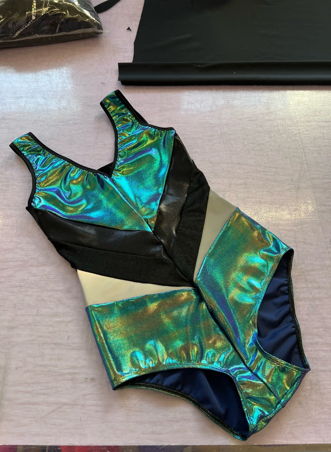 green metallic panelled bodysuit