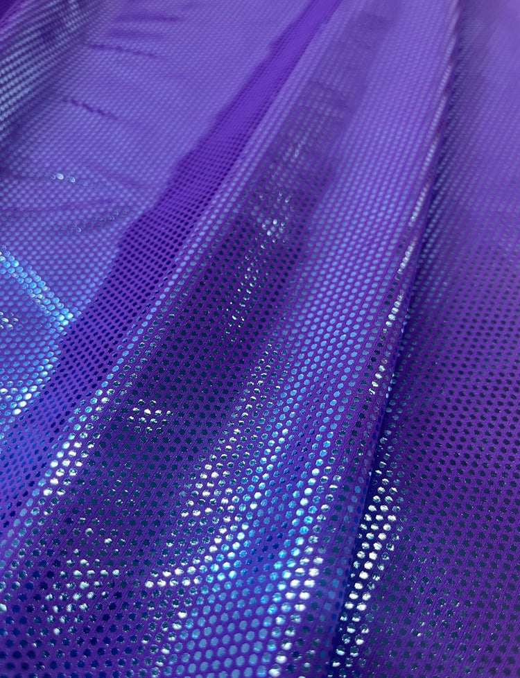 Blue spotted foil fabric on a purple stretch base.