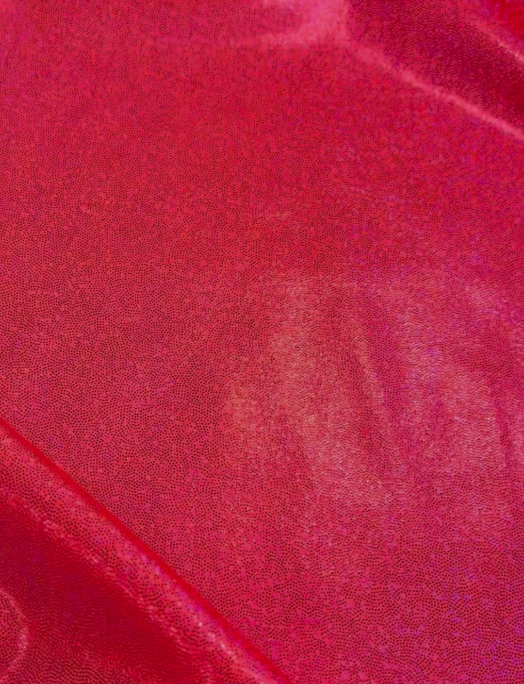 Coral pink holographic foil spandex fabric.