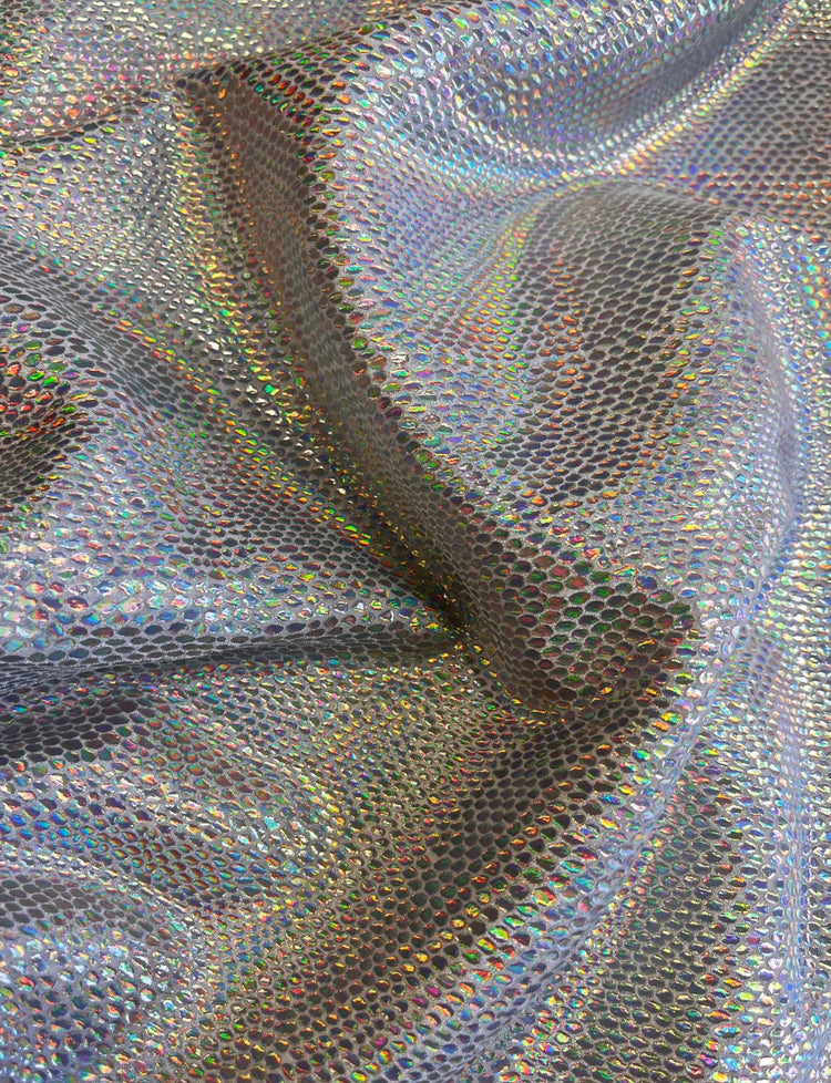 Silver holographic lizard print stretch velvet fabric.