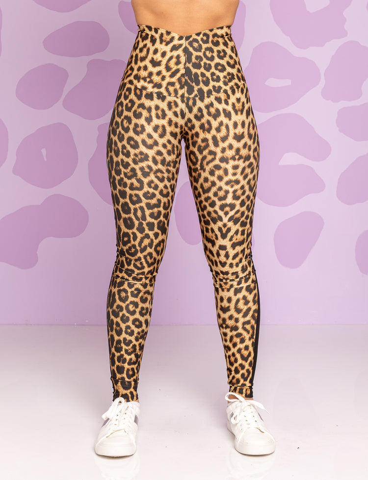 Lady wearing high waisted leggings, front view.