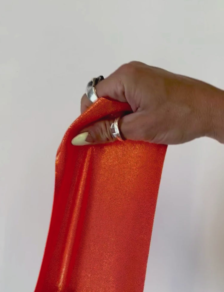 orange metallic stretch fabric swatch